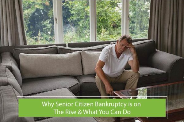 older man sitting on a couch looking stressed