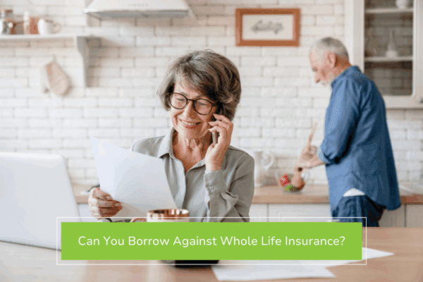 Woman on the phone reviewing her whole life insurance policy